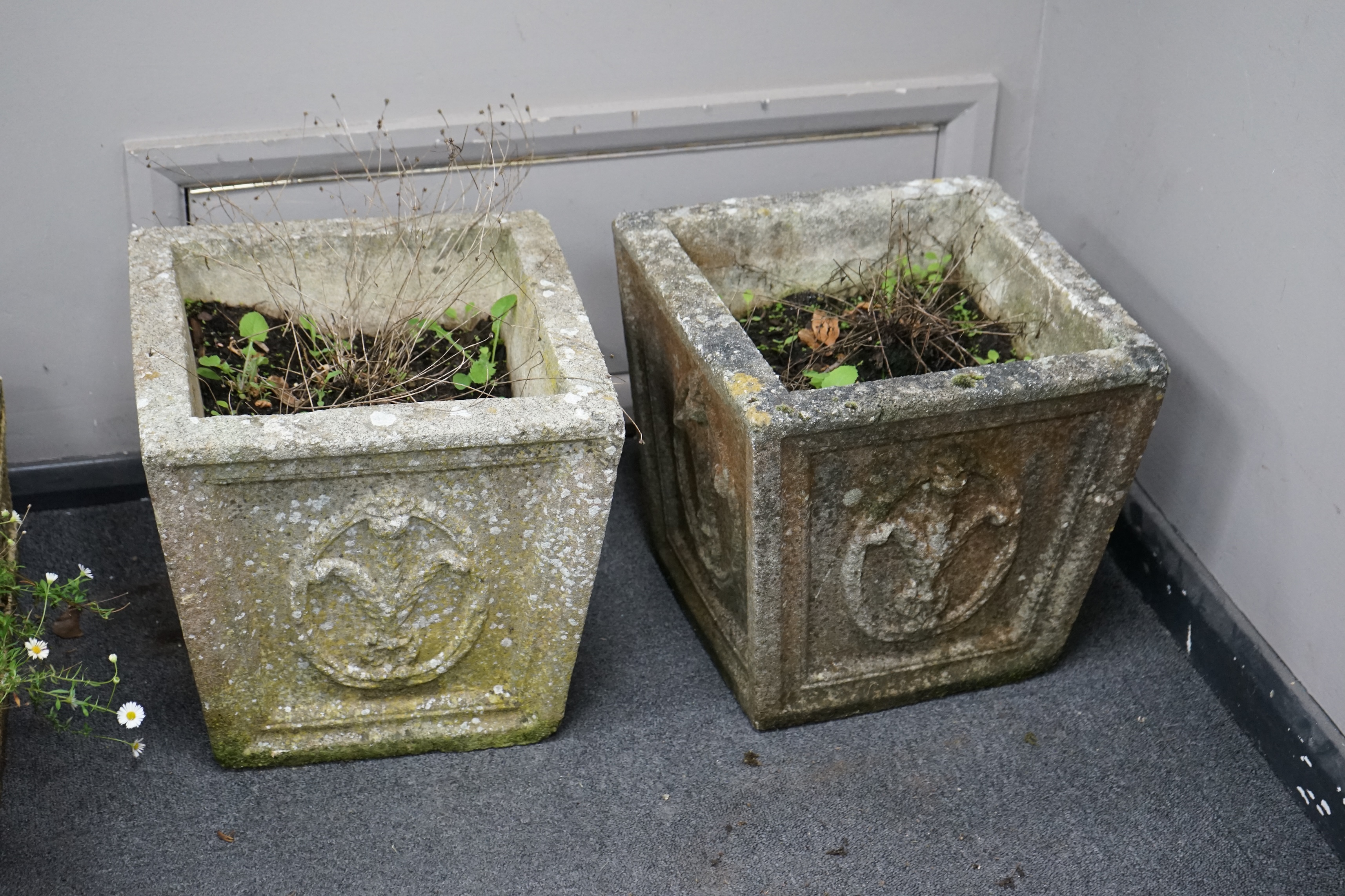 A pair of square tapered reconstituted stone garden planters